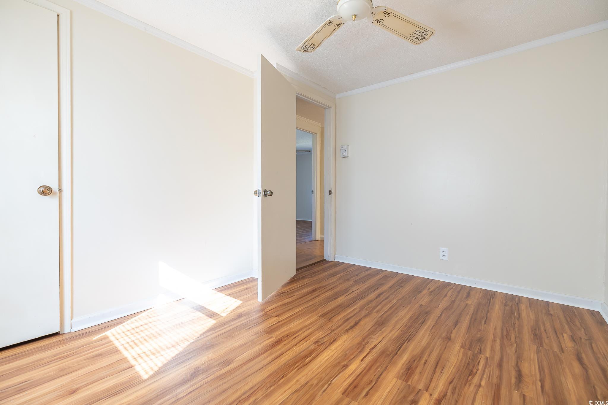 101 County Rd S-22-732 Georgetown, SC 29440 - Photo 7 of 17 Empty room featuring baseboards, ceiling fan, crow