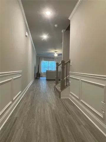 a view of entryway with stairs and wooden floor