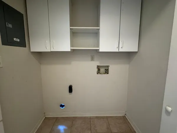 a view of cabinets and wooden floor