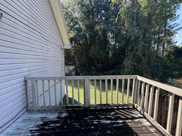 a view of a back yard of the house