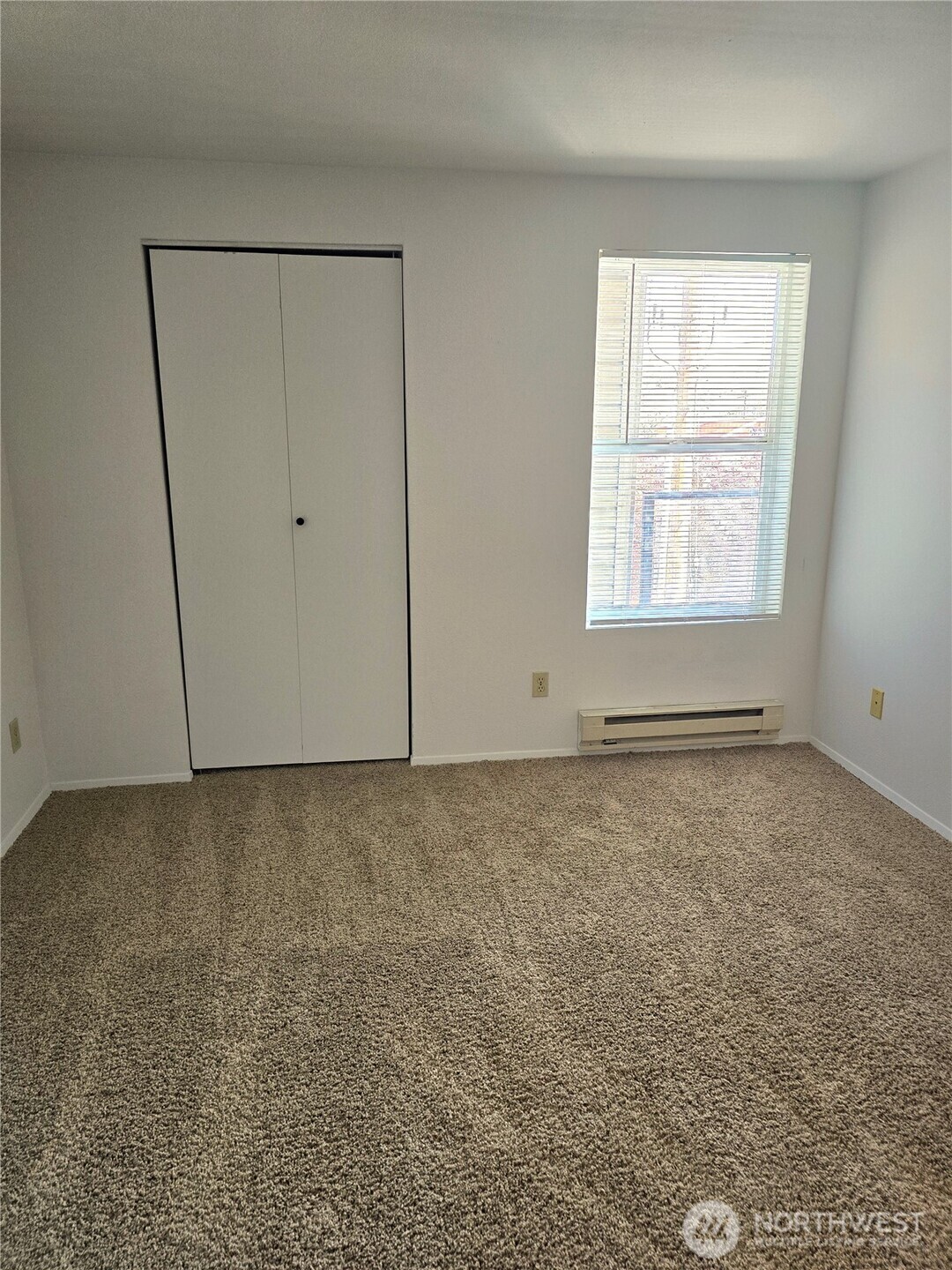 3022 Southwest Bradford Street, Unit 210 Seattle, WA 98126 - Photo 7 of 17 an empty room with a empty space and a window