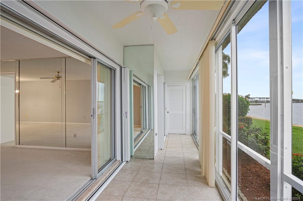 1868 Southwest Palm City Road, Unit 104 Stuart, FL 34994 - Photo 21 of 31 Back porch with accordion shutters
