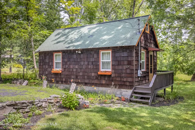 a backyard of a house with seating space