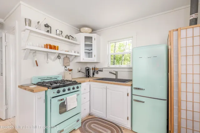 a kitchen with stainless steel appliances granite countertop a stove and a sink