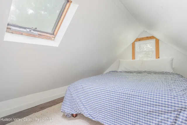 a view of a living room with a fireplace