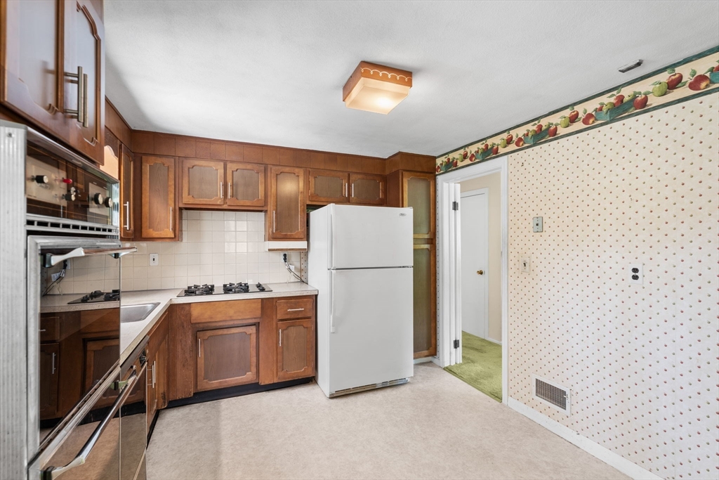 348 Belknap Road Framingham, MA 01701 - Photo 8 of 35 a kitchen with stainless steel appliances a refrigerator and a sink