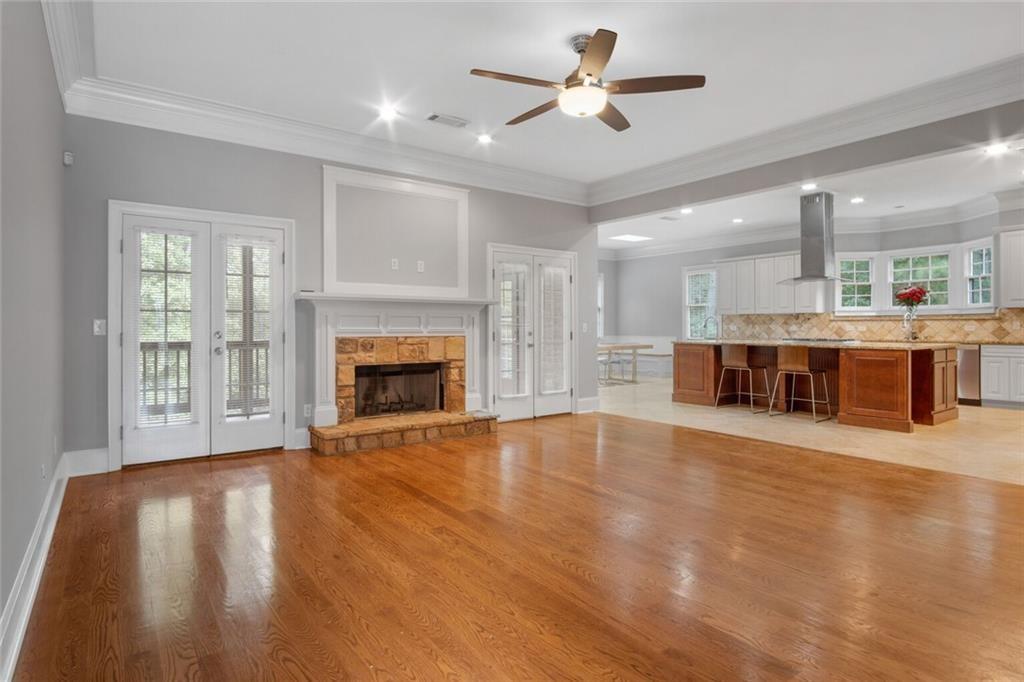 4387 Old Fairburn Road Atlanta, GA 30349 - Photo 11 of 21 a view of a room with a fireplace and wooden floor