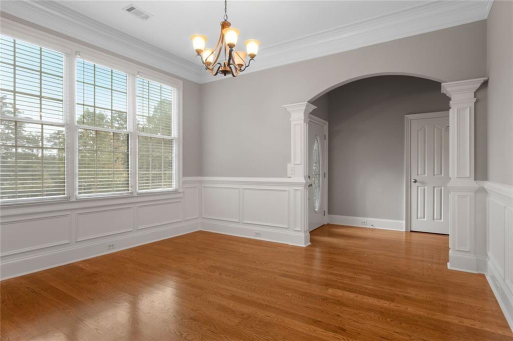 4387 Old Fairburn Road Atlanta, GA 30349 - Photo 12 of 21 a view of empty room with wooden floor and fan