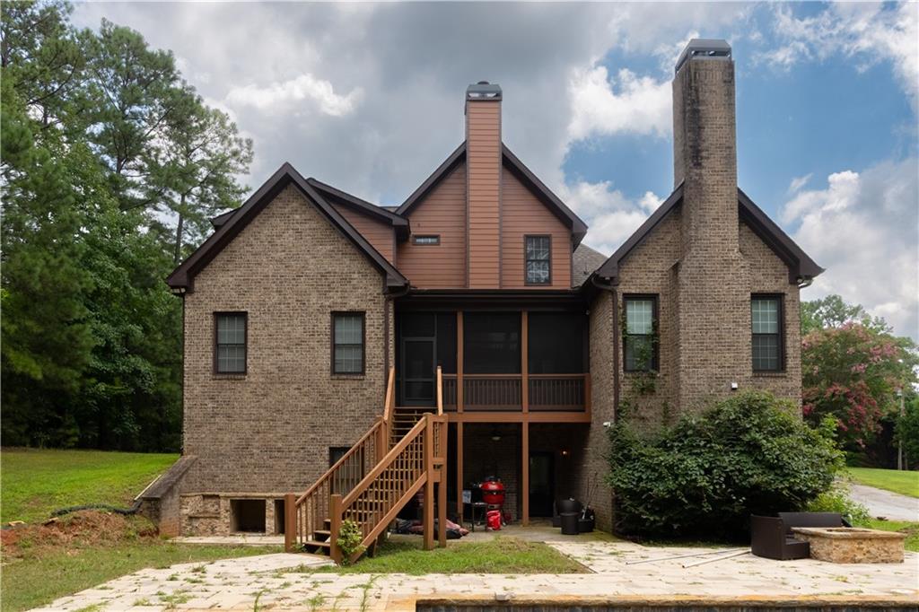 4387 Old Fairburn Road Atlanta, GA 30349 - Photo 20 of 21 a front view of a house with a yard