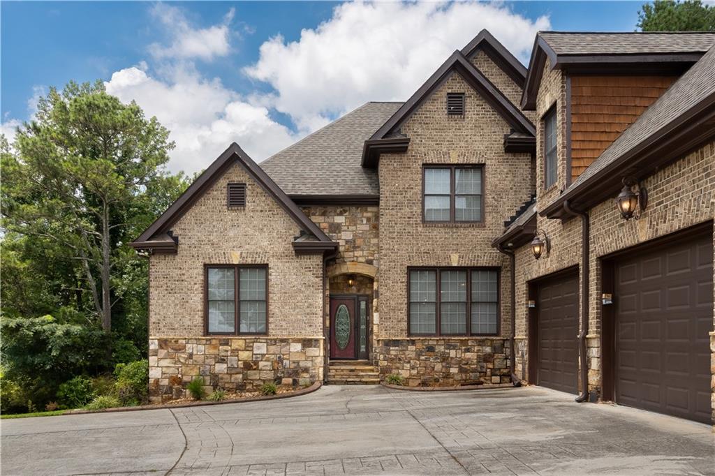 4387 Old Fairburn Road Atlanta, GA 30349 - Photo 2 of 21 a front view of a house with lots of trees