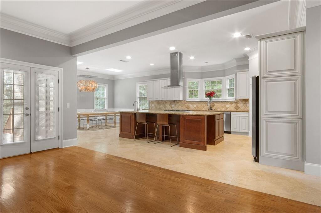 4387 Old Fairburn Road Atlanta, GA 30349 - Photo 7 of 21 a kitchen with stainless steel appliances a refrigerator and a stove top oven