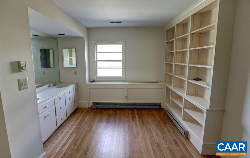 1215 Rugby Road Charlottesville, VA 22903 - Photo 13 of 20 a bathroom with a wooden floor and a window