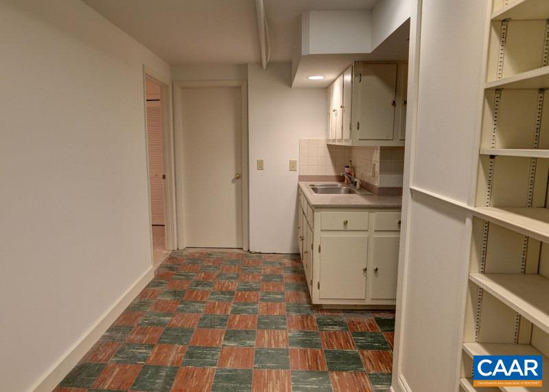 1215 Rugby Road Charlottesville, VA 22903 - Photo 19 of 20 a room with a stove and a cabinet