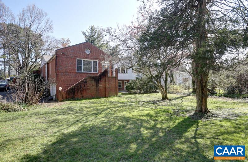 1215 Rugby Road Charlottesville, VA 22903 - Photo 3 of 20 a house is sitting in middle of the forest