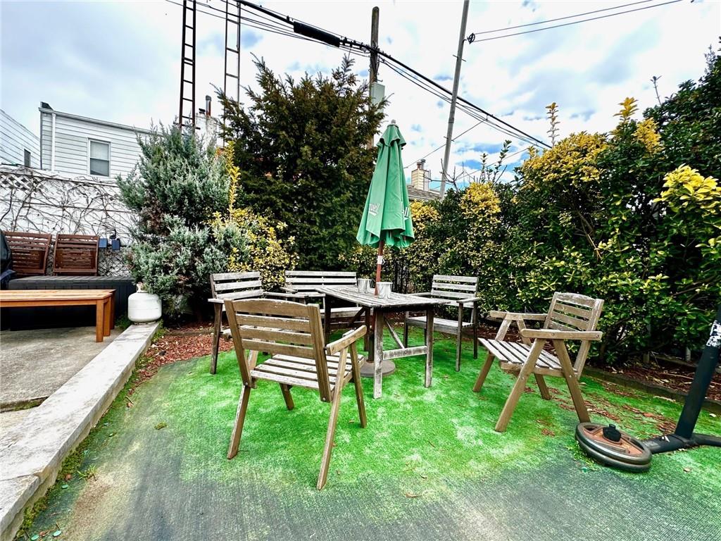 1453 85th Street Brooklyn, NY 11228 - Photo 15 of 18 a view of a backyard with sitting area