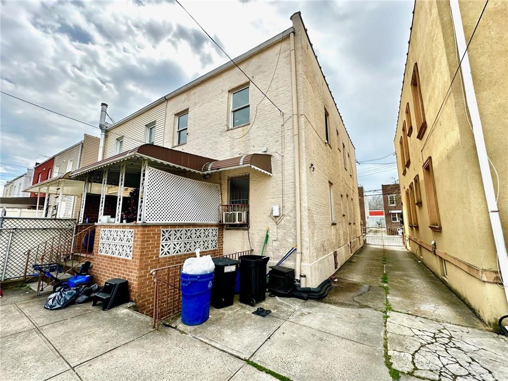 1453 85th Street Brooklyn, NY 11228 - Photo 18 of 18 a view of a white house with many windows
