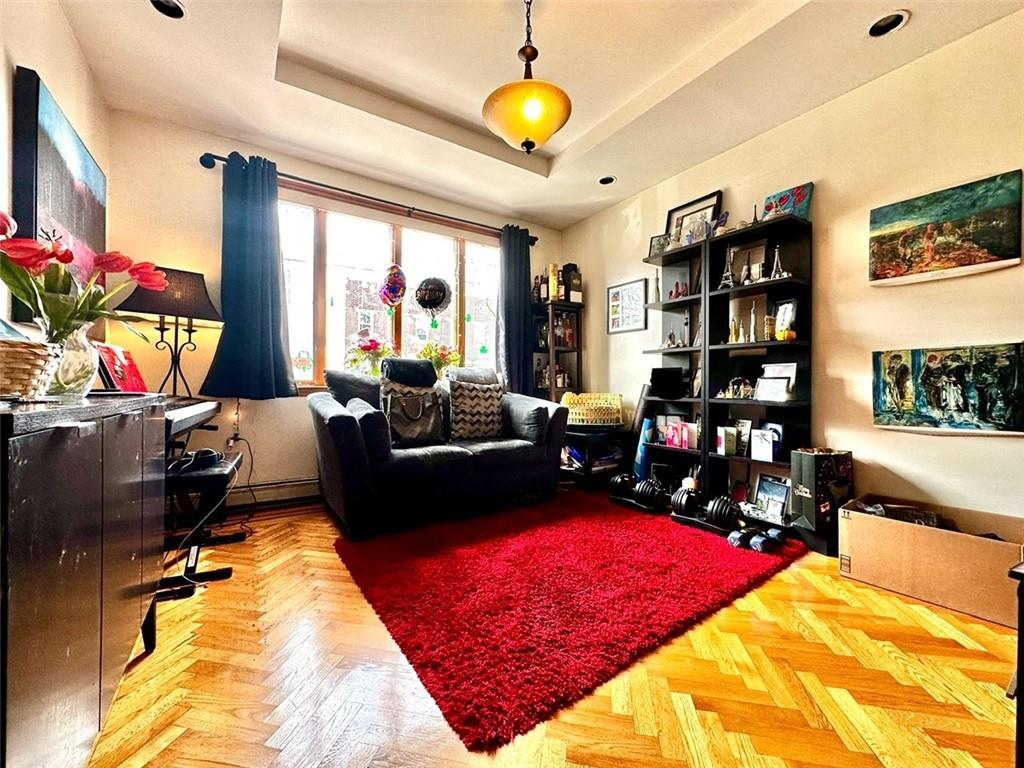 1453 85th Street Brooklyn, NY 11228 - Photo 4 of 18 a living room with furniture rug and window