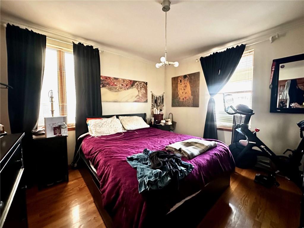 1453 85th Street Brooklyn, NY 11228 - Photo 5 of 18 a bedroom with a bed window and dresser