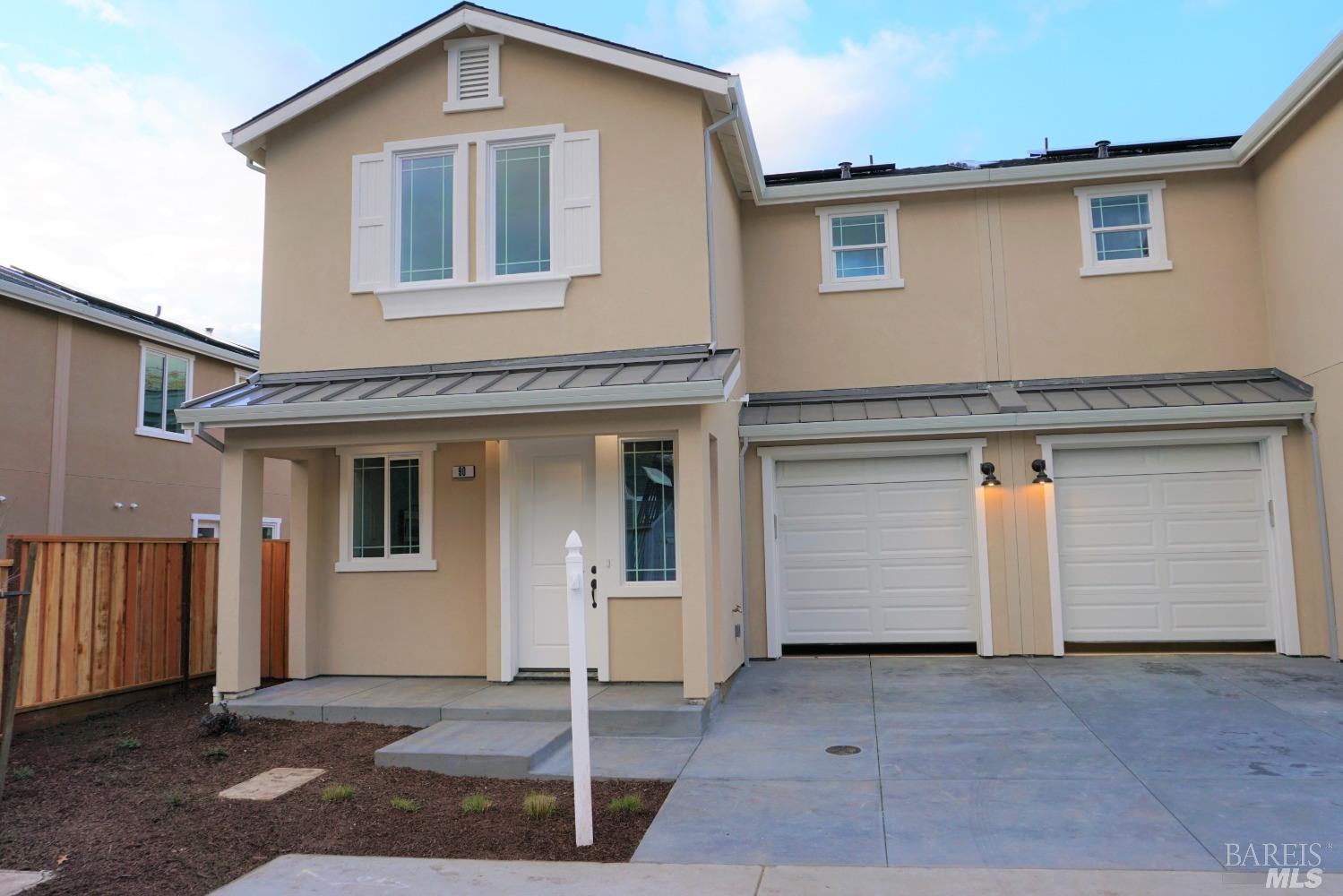 a front view of a house with a garage