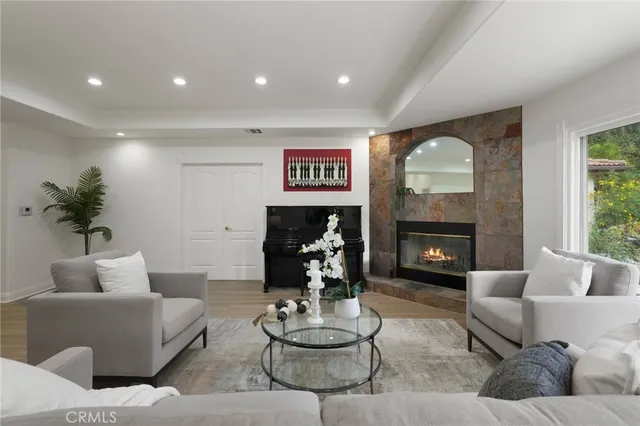 a kitchen with a sink refrigerator and cabinets