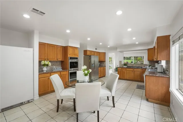 a bathroom with a granite countertop shower and a sink