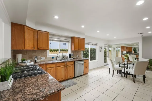 a spacious bedroom with a bed and a couch