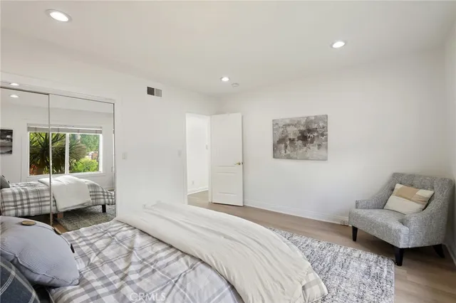 a garden with trees in front of it