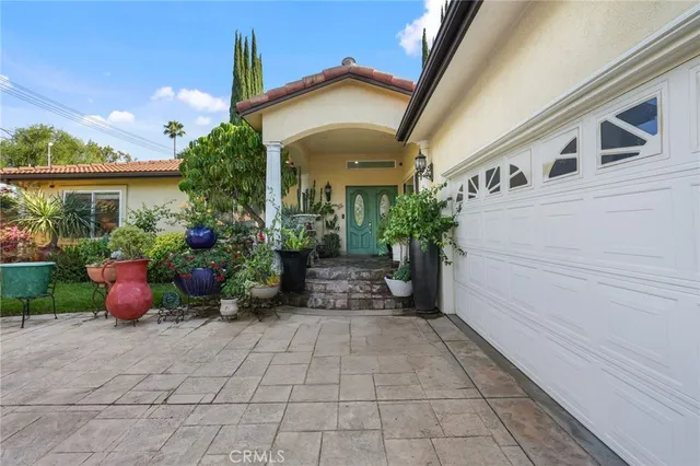 a view of a potted plants in front of a house