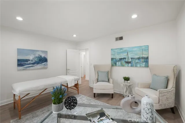 a view of a house with backyard and sitting area