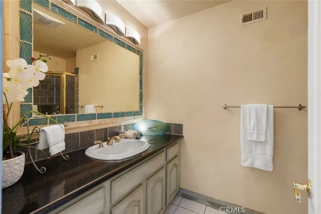 an aerial view of a house with a garden and plants