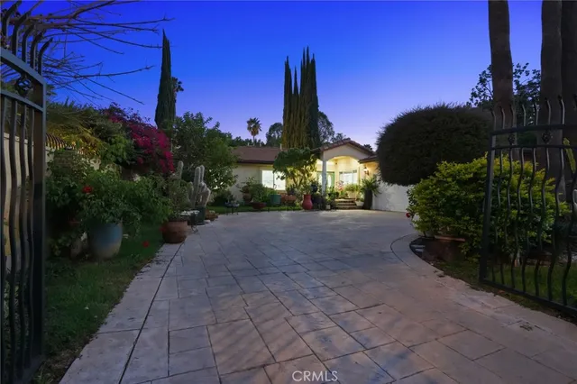 a living room with fireplace furniture and a flat screen tv