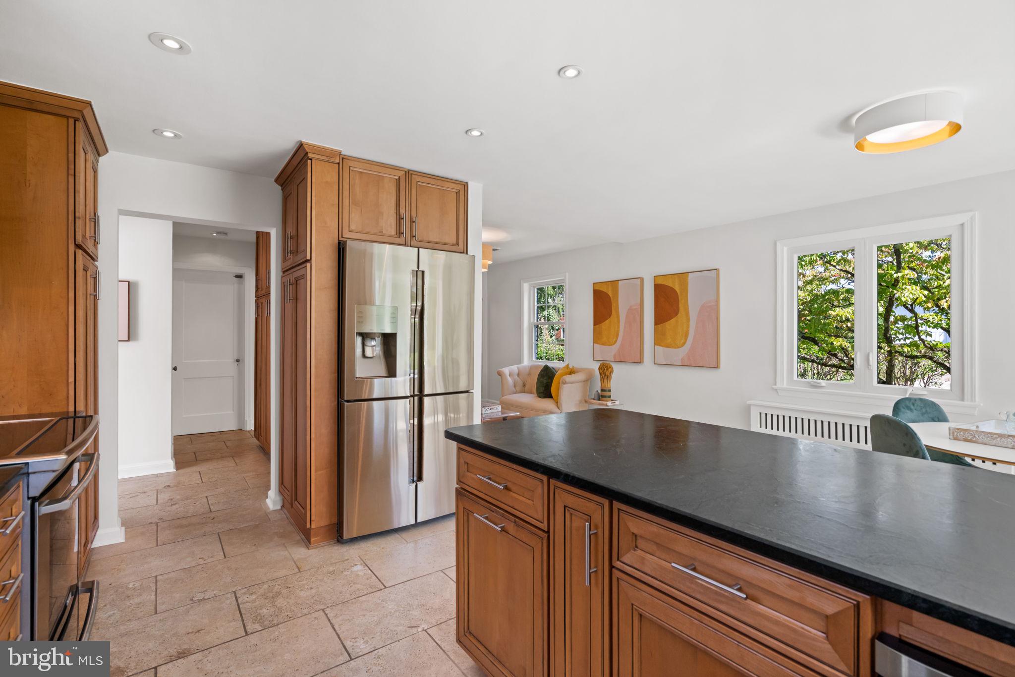 4900 Montgomery Avenue Bethesda, MD 20816 - Photo 11 of 57 a kitchen with stainless steel appliances a refrigerator and a sink