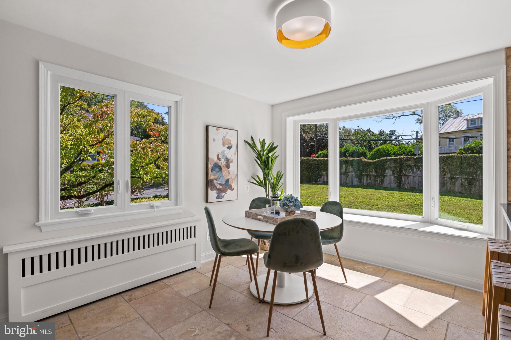 4900 Montgomery Avenue Bethesda, MD 20816 - Photo 12 of 57 a dining room with furniture and a large window