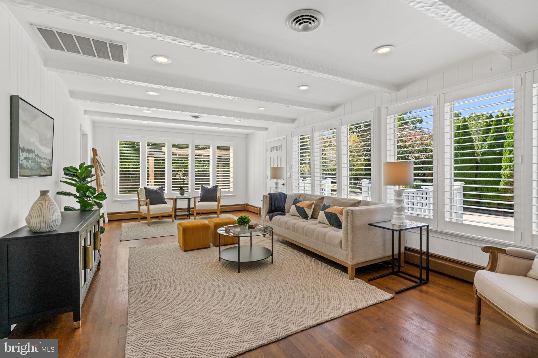 4900 Montgomery Avenue Bethesda, MD 20816 - Photo 15 of 57 a living room with furniture and floor to ceiling windows