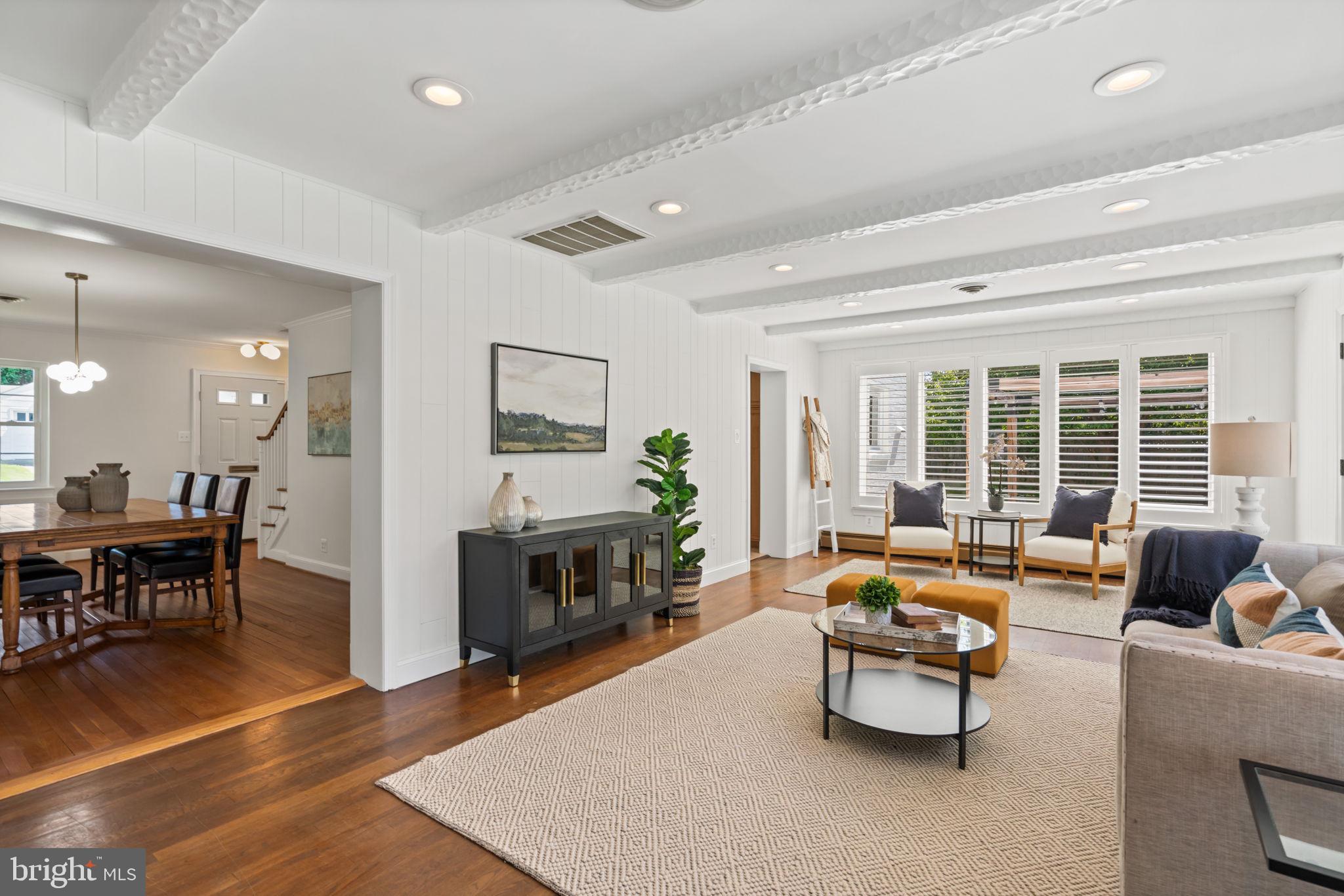 4900 Montgomery Avenue Bethesda, MD 20816 - Photo 16 of 57 a living room with furniture and a fireplace