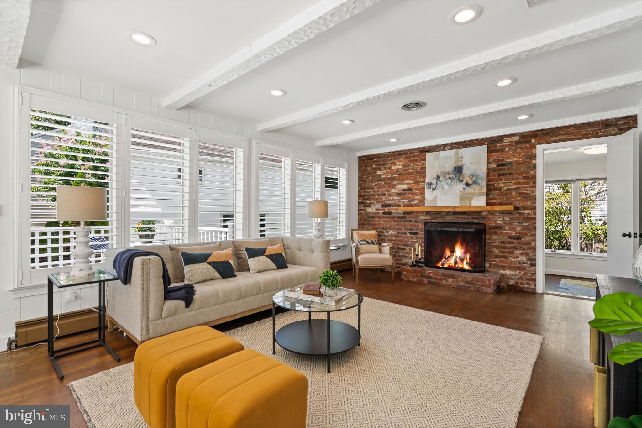 4900 Montgomery Avenue Bethesda, MD 20816 - Photo 17 of 57 a living room with furniture and a fireplace