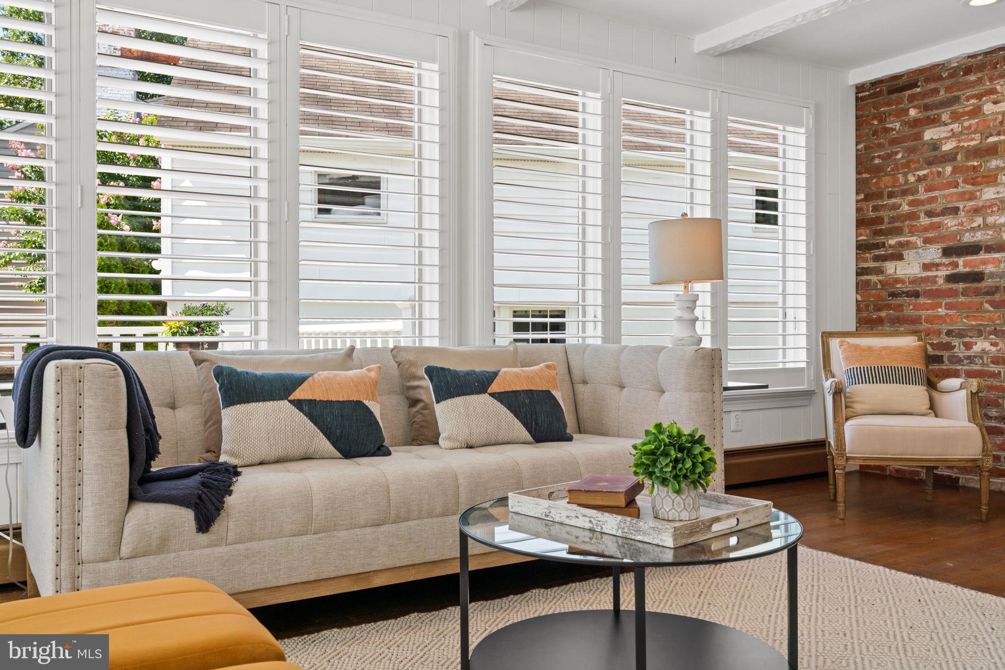 4900 Montgomery Avenue Bethesda, MD 20816 - Photo 19 of 57 a living room with furniture and a large window