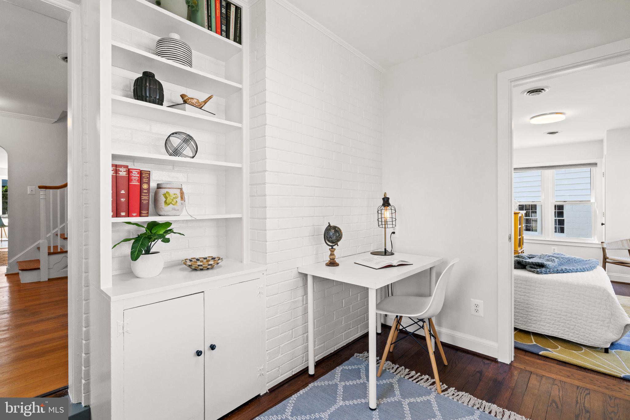 4900 Montgomery Avenue Bethesda, MD 20816 - Photo 23 of 57 a view of a workspace with furniture and wooden floor