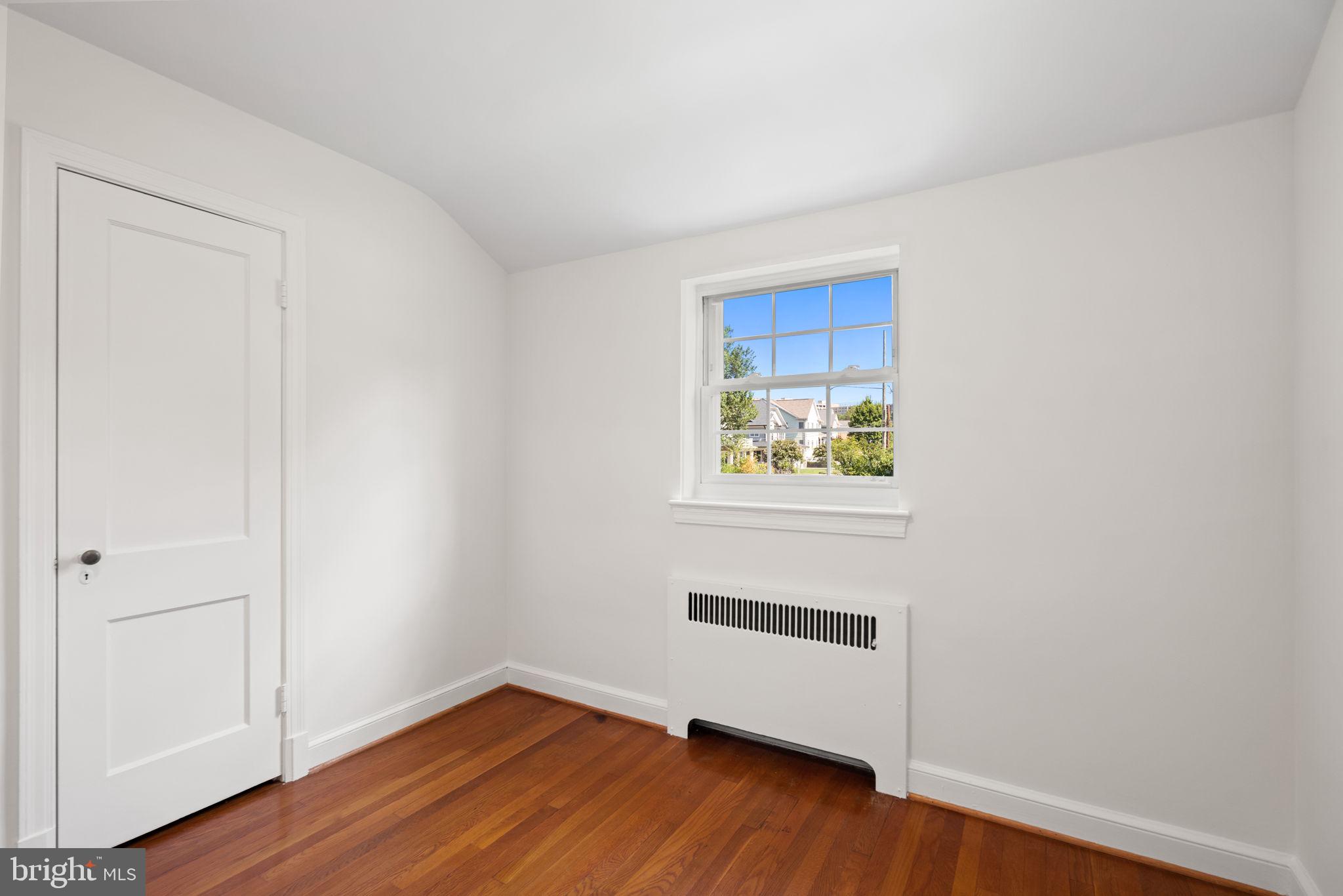 4900 Montgomery Avenue Bethesda, MD 20816 - Photo 31 of 57 a view of an empty room with wooden floor