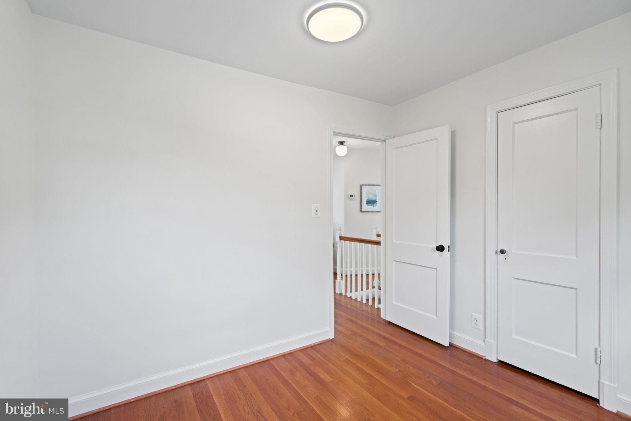 4900 Montgomery Avenue Bethesda, MD 20816 - Photo 32 of 57 a view of a room with wooden floor