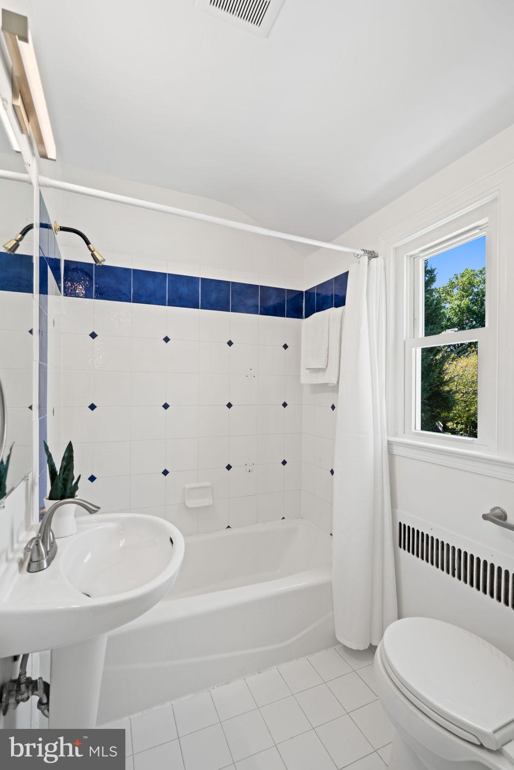 4900 Montgomery Avenue Bethesda, MD 20816 - Photo 33 of 57 a bathroom with a sink and a bathtub
