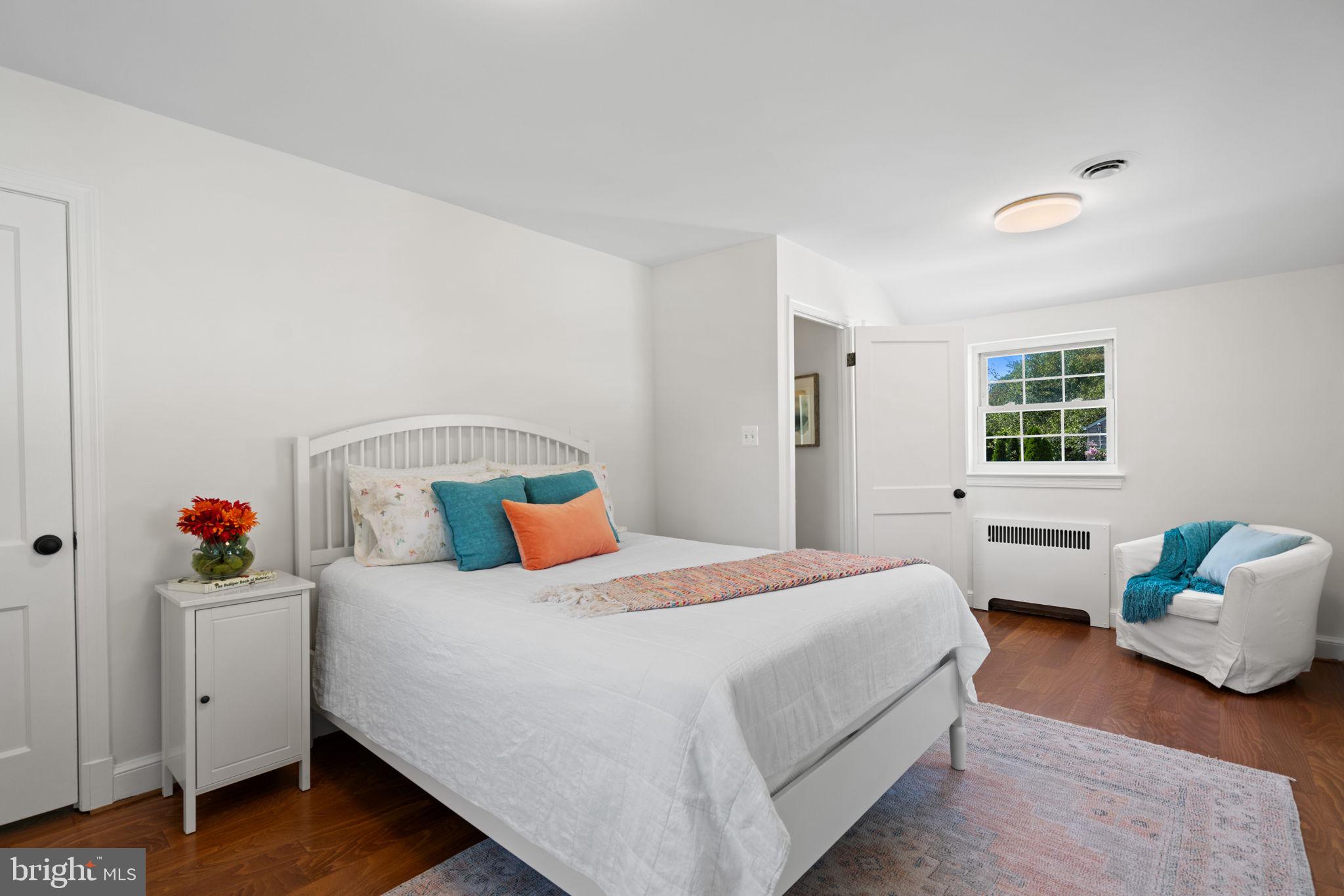 4900 Montgomery Avenue Bethesda, MD 20816 - Photo 36 of 57 a bedroom with a bed and wooden floor