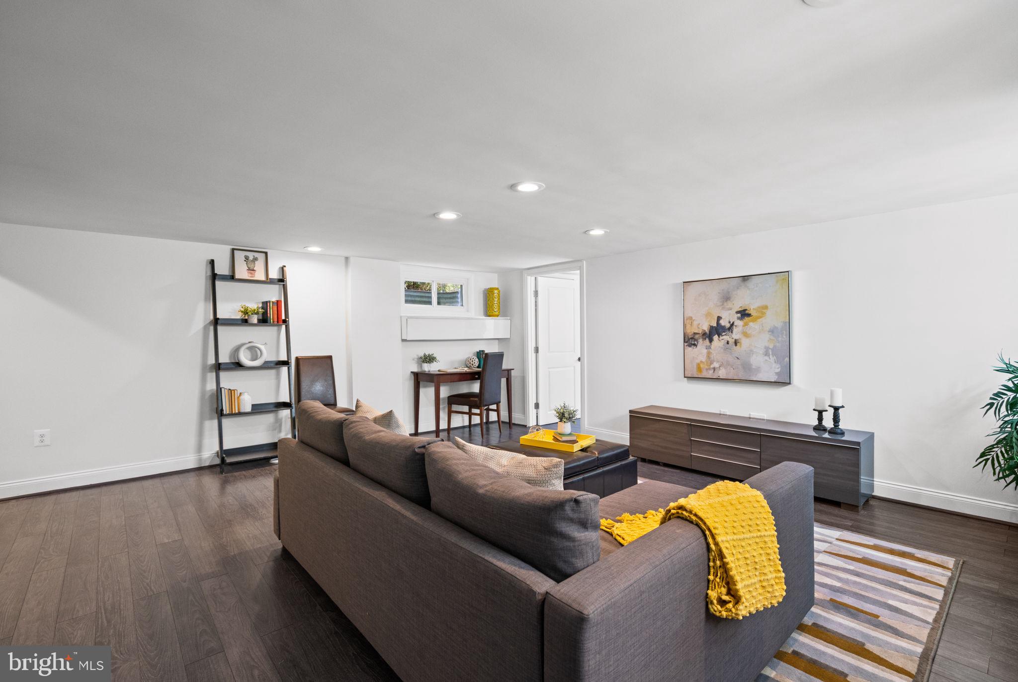 4900 Montgomery Avenue Bethesda, MD 20816 - Photo 40 of 57 a living room with furniture and a wooden floor