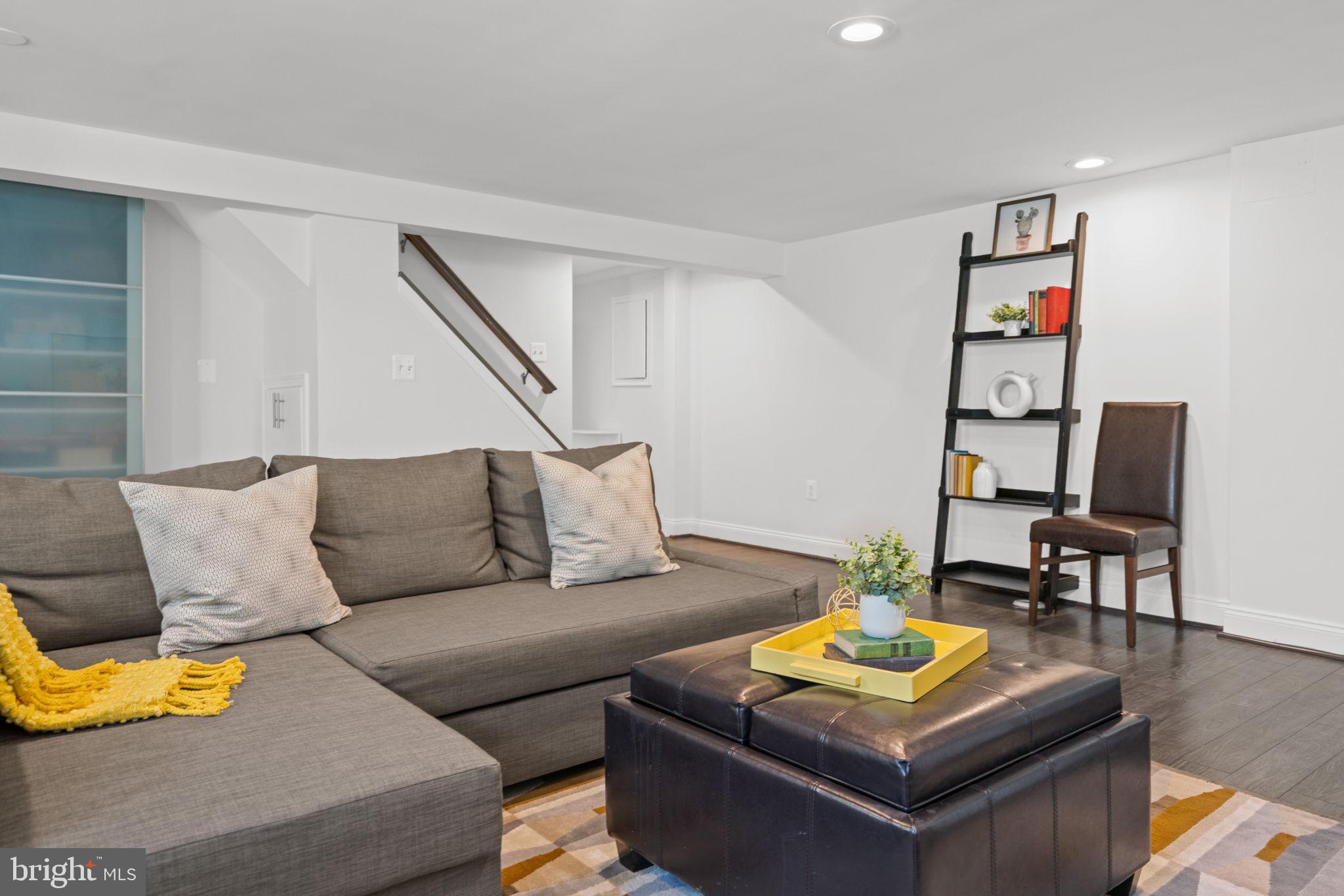 4900 Montgomery Avenue Bethesda, MD 20816 - Photo 42 of 57 a living room with furniture and a flat screen tv
