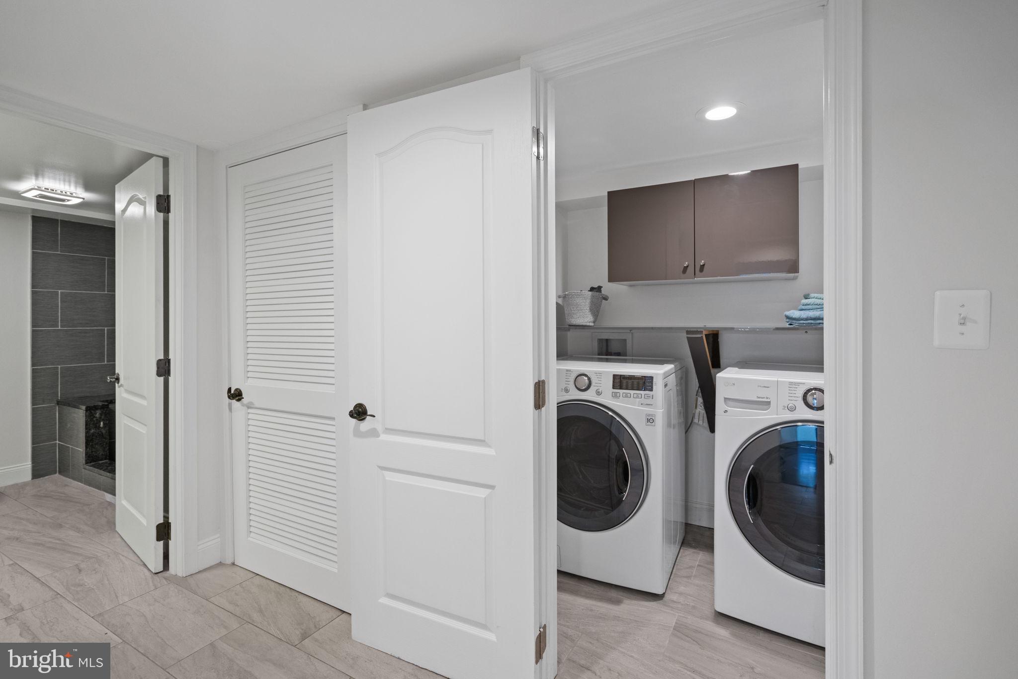 4900 Montgomery Avenue Bethesda, MD 20816 - Photo 44 of 57 a view of a hallway with washer and dryer