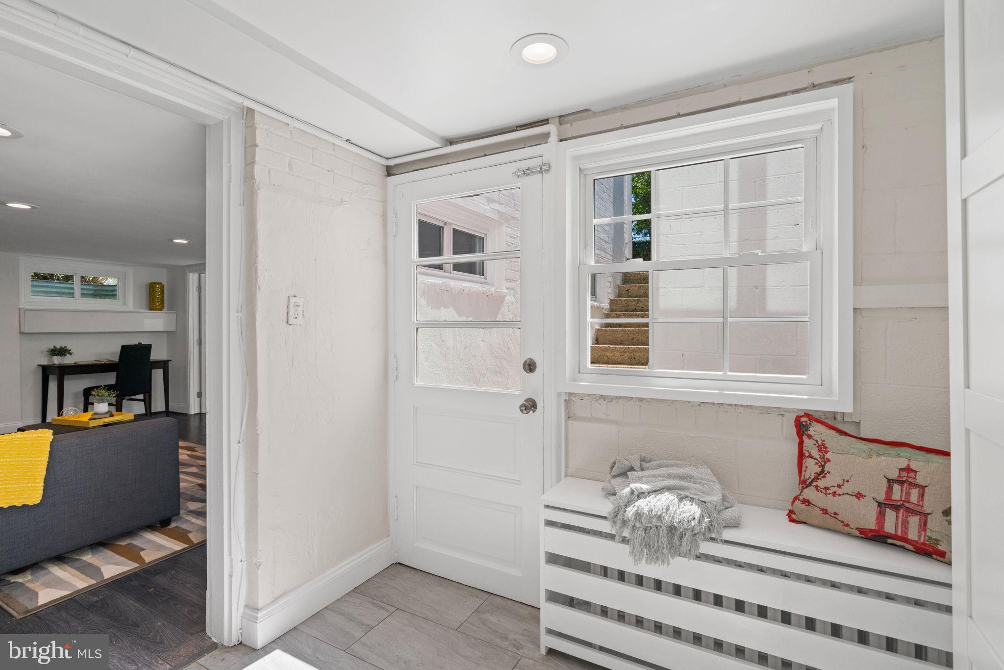 4900 Montgomery Avenue Bethesda, MD 20816 - Photo 49 of 57 a living room with furniture and floor to ceiling window