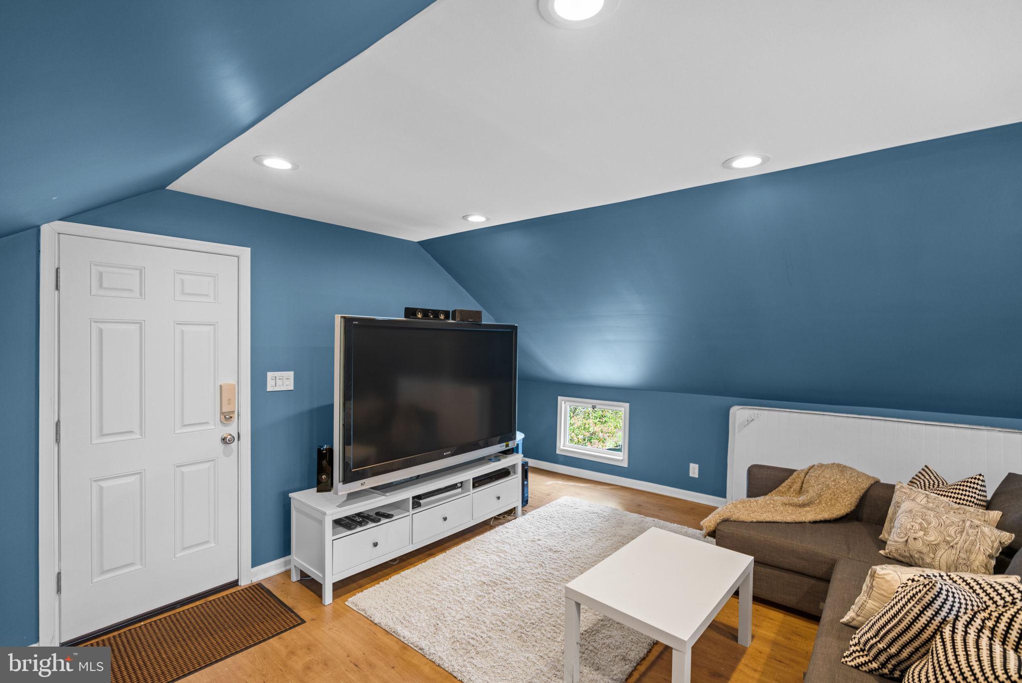 4900 Montgomery Avenue Bethesda, MD 20816 - Photo 56 of 57 a living room with furniture and a flat screen tv