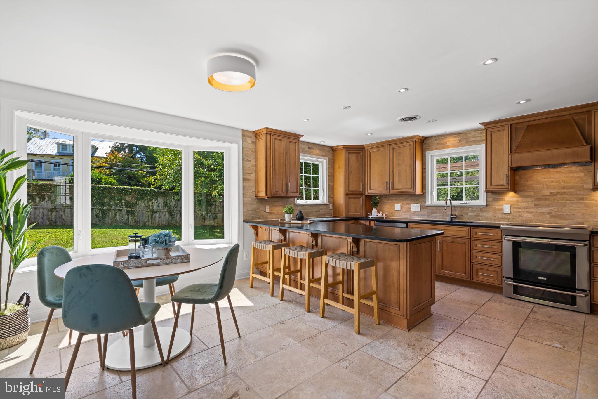 4900 Montgomery Avenue Bethesda, MD 20816 - Photo 7 of 57 a view of a dining room with furniture window and outside view