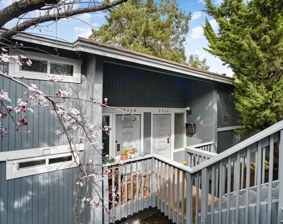 a view of a house with a small yard