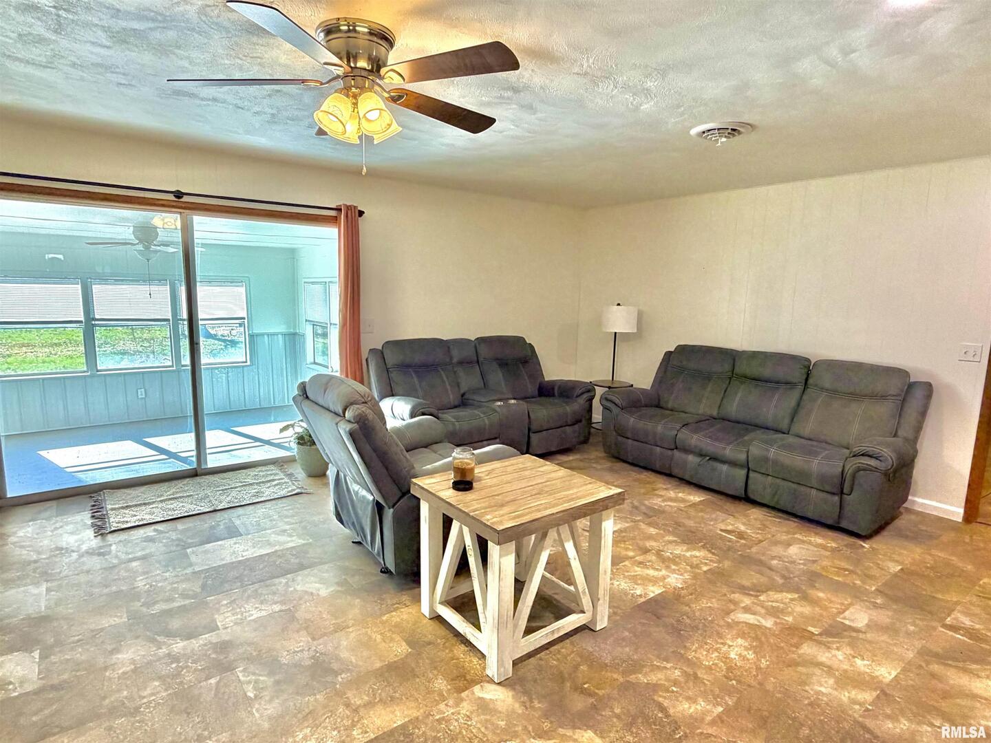 315 Hosselton Street Southwest Clay City, IL 62824 - Photo 12 of 70 a view of a livingroom with furniture and floor to ceiling window